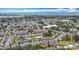 Beautiful aerial view of a residential community, featuring lush greenery, a sparkling pool, and picturesque surroundings at 2321 Canal Dr # F25, Bradenton, FL 34207
