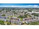 Expansive aerial view of a condo community surrounded by lush greenery and a cityscape at 2321 Canal Dr # F25, Bradenton, FL 34207