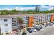 Aerial view of complex showcasing balconies, landscaping, and ample parking at 2321 Canal Dr # F25, Bradenton, FL 34207