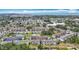 Expansive aerial view showcasing the community's layout, pool, landscaping, and proximity to the waterfront at 2321 Canal Dr # F25, Bradenton, FL 34207