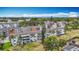 Aerial perspective of a condo complex boasting well-kept grounds and mature palm trees at 2321 Canal Dr # F25, Bradenton, FL 34207