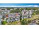 Wide aerial shot of a condominium community with meticulously landscaped grounds and nearby amenities at 2321 Canal Dr # F25, Bradenton, FL 34207