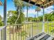 Balcony with view of backyard and palm trees at 2321 Canal Dr # F25, Bradenton, FL 34207
