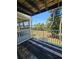 Balcony with wood floors showcasing the beautiful trees and landscaping outside at 2321 Canal Dr # F25, Bradenton, FL 34207