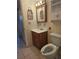 Cozy bathroom features a wood vanity and ceramic tile flooring at 2321 Canal Dr # F25, Bradenton, FL 34207