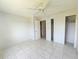This bedroom has tile flooring, closets, and plenty of natural light at 2321 Canal Dr # F25, Bradenton, FL 34207