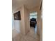 Bedroom showcasing a dark wood bed frame and natural light from a window at 2321 Canal Dr # F25, Bradenton, FL 34207