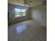 Bedroom with tile flooring, a ceiling fan, and a window with a view at 2321 Canal Dr # F25, Bradenton, FL 34207