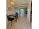 Open concept dining and living space with access to kitchen at 2321 Canal Dr # F25, Bradenton, FL 34207
