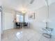 Bright dining space with tile floor and access to front door at 2321 Canal Dr # F25, Bradenton, FL 34207