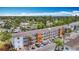 Low-angle exterior view of a condominium building with ample parking and colorful facade at 2321 Canal Dr # F25, Bradenton, FL 34207