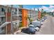 Exterior view of condo building with staircases, palm trees, and parking spaces at 2321 Canal Dr # F25, Bradenton, FL 34207