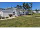Charming condo building featuring brick pathways, lush landscaping, and a well-maintained exterior at 2321 Canal Dr # F25, Bradenton, FL 34207