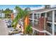 Exterior shot of condo units featuring brick stairways, walkways, and mature palm trees at 2321 Canal Dr # F25, Bradenton, FL 34207