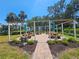 Relaxing community area with picnic tables and umbrellas provides a gathering place for residents to socialize and enjoy the outdoors at 2321 Canal Dr # F25, Bradenton, FL 34207