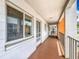 Well-maintained hallway of units with white walls, and pops of orange color at 2321 Canal Dr # F25, Bradenton, FL 34207