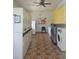 Clean community laundry room with multiple washers and dryers for convenient resident use at 2321 Canal Dr # F25, Bradenton, FL 34207
