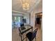 Comfortable living area with dining table, sliding door, and kitchen view at 2321 Canal Dr # F25, Bradenton, FL 34207