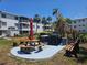 A well-maintained community picnic area with tables, benches, and a barbecue grill for outdoor gatherings and relaxation at 2321 Canal Dr # F25, Bradenton, FL 34207