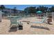 Community pool deck featuring lounge chairs, tables, and umbrellas, creating a perfect oasis for relaxation and leisure at 2321 Canal Dr # F25, Bradenton, FL 34207