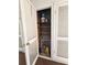 Exterior hallway storage area with wooden shelves and bi-fold doors at 2321 Canal Dr # F25, Bradenton, FL 34207
