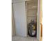 Water heater in closet with sliding door and shelving at 2321 Canal Dr # F25, Bradenton, FL 34207