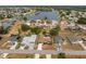 Expansive aerial view of a residential community surrounding a scenic lake, offering serene waterfront living at 2408 Montpelier Rd, Punta Gorda, FL 33983