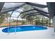 This gorgeous pool has a screened-in lanai that is perfect for swimming and entertaining at 2408 Montpelier Rd, Punta Gorda, FL 33983