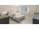 Bright bedroom with a comfortable bed, accent pillows, and a well-lit space at 2435 Terry Ln, Sarasota, FL 34231