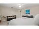 Spacious bedroom with storage units, a large comfy bed, and light neutral tones at 2435 Terry Ln, Sarasota, FL 34231