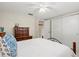 Neat bedroom with a bed, a dresser, closet space, and cozy neutral tones at 2435 Terry Ln, Sarasota, FL 34231