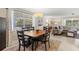 Cozy dining room with a wood table and a large window providing natural light at 2435 Terry Ln, Sarasota, FL 34231