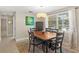 Inviting dining area featuring neutral tones, a large window, and comfortable seating for six at 2435 Terry Ln, Sarasota, FL 34231