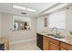 Kitchen view with stainless steel appliances, granite countertops, and convenient breakfast bar at 2435 Terry Ln, Sarasota, FL 34231