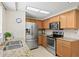 Modern kitchen featuring stainless steel appliances, granite countertops, and ample cabinet space at 2435 Terry Ln, Sarasota, FL 34231