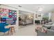Comfortable living area with tile flooring, ceiling fan, and open layout that connects to other spaces at 2435 Terry Ln, Sarasota, FL 34231