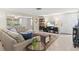 Inviting living room with tile floors, and comfortable seating arrangement offering a relaxing atmosphere at 2435 Terry Ln, Sarasota, FL 34231