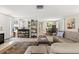 Spacious living room with tile flooring and a stylish sectional couch with a dining area at 2435 Terry Ln, Sarasota, FL 34231