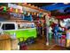 Lively restaurant interior with colorful decor, a bar, and seating areas for diners at 2435 Terry Ln, Sarasota, FL 34231