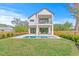A spacious backyard featuring a modern two-story home with a refreshing in-ground pool at 2554 Arlington St, Sarasota, FL 34239