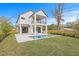 A well-maintained backyard showcases a modern two-story home and in-ground pool at 2554 Arlington St, Sarasota, FL 34239