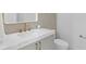 Elegant bathroom with quartz countertop, patterned tile, modern fixtures, and a sleek toilet at 2554 Arlington St, Sarasota, FL 34239