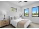 Airy bedroom with a cozy bed, soft throw, and a contemporary nightstand with stylish lamps at 2554 Arlington St, Sarasota, FL 34239