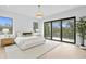 Bright bedroom with large windows, a chandelier, and a decorative plant at 2554 Arlington St, Sarasota, FL 34239