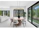 Dining room with view into back yard and pool, adjacent to living room at 2554 Arlington St, Sarasota, FL 34239