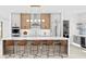 Gourmet kitchen with stone countertops, island seating and stainless steel appliances at 2554 Arlington St, Sarasota, FL 34239