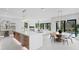 Open concept kitchen with an island and bar seating plus an adjacent dining and living area at 2554 Arlington St, Sarasota, FL 34239