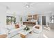 Open-concept living space with a modern kitchen, dining area, and cozy seating at 2554 Arlington St, Sarasota, FL 34239