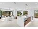 Open concept kitchen and living room with sliding glass doors leading to the backyard at 2554 Arlington St, Sarasota, FL 34239