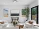 Bright living room with large windows, modern decor, and a neutral color palette at 2554 Arlington St, Sarasota, FL 34239